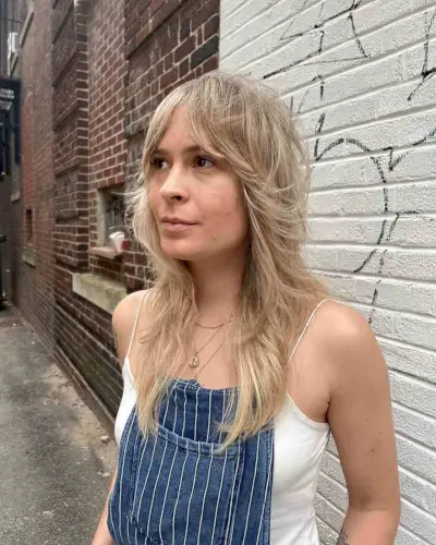 Curtain Bangs and Face-Framing Feathered Layers for Square Faces