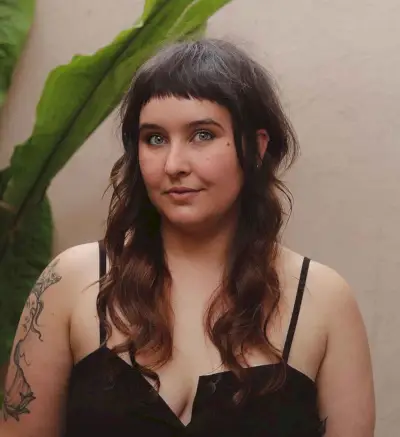 Classic baby bangs on a long shag haircut