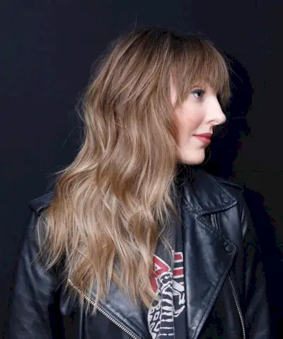 Messy long layered hair with blunt bangs