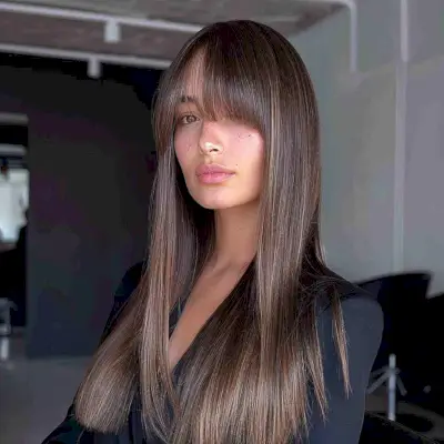 blunt cut long hair with side bangs