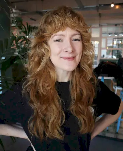 Mid-Back Shag with Feathered Layers and Bangs for Curly Hair
