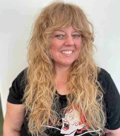 Long Curly Shag with Feathered Bangs on Women Over 50