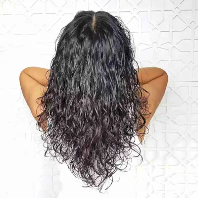 Curly Layered V-Cut with a Middle Part on Black-Haired Ladies