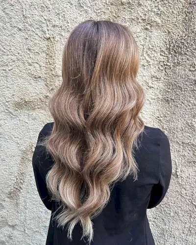 Long Layered V-Cut Hair with Soft Waves and Warm Shade