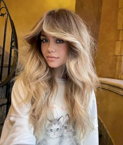 Voluminous Curtain Bangs for Long Tousled Hair