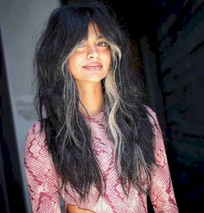 Long Shaggy Thick Black Hair with a Blonde Money Piece