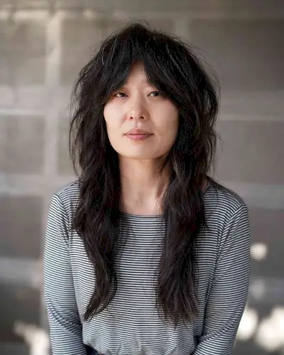 70s Long Shag with Razored Layers for Women Over 50 with Thick Hair