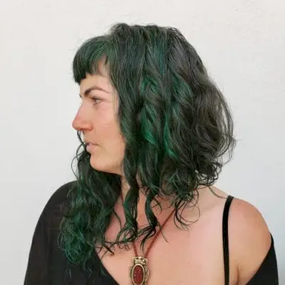 curly asymmetrical long bob with bangs