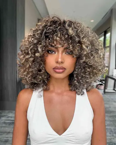 Layered Curly Long Bob with Bangs