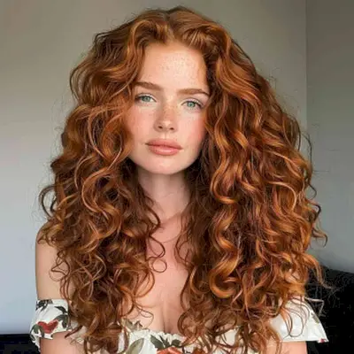 Flattering Long Curly Haircut with Middle Part for Oval Faces