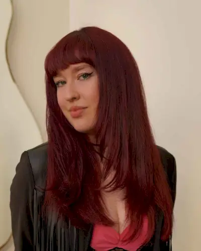 strong long layered red hair with a fringe