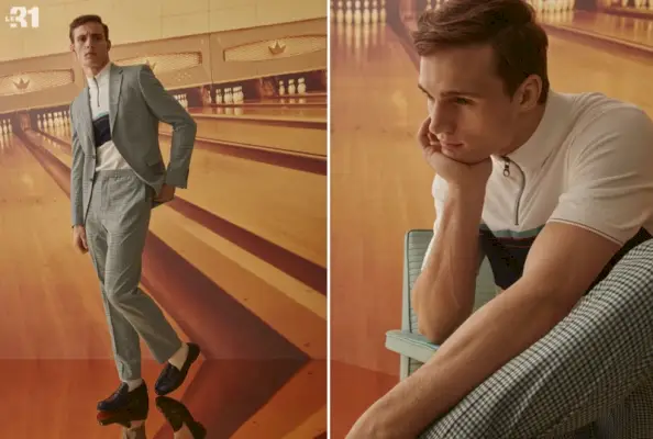 Adoptant un style rétro, Julian Schneyder porte une veste à carreaux vichy LE 31 et un pantalon de jogging avec un pull à col demi-zippé.