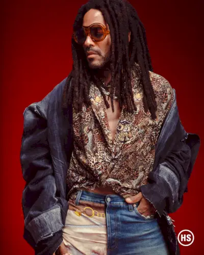 Als Ausdruck seines persönlichen Stils trägt Lenny Kravitz auch Gucci-Jeans mit einer Diesel-Jacke.