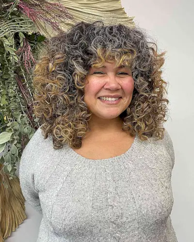 Medium-Length Deva-Cut Thick Curls for Round Faces and prominent cheekbones