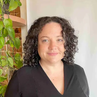 Medium Center-Parted Curls with Layers for Round Faces