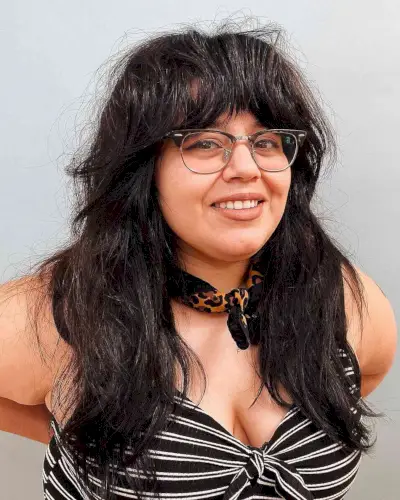 Layered Loveliness with Wide Bangs for Round Faces