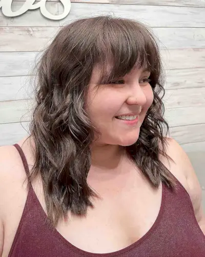 wavy long layers and textured fringe for round faces