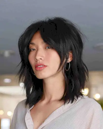 Shoulder-Length Shaggy Bob with Curtain Bangs