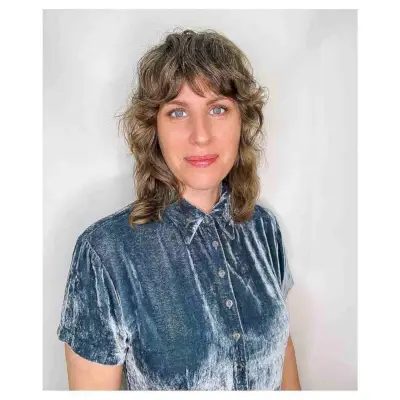 Medium-Length Shagged Cut with Soft Curls and Fringe for Women Over 40