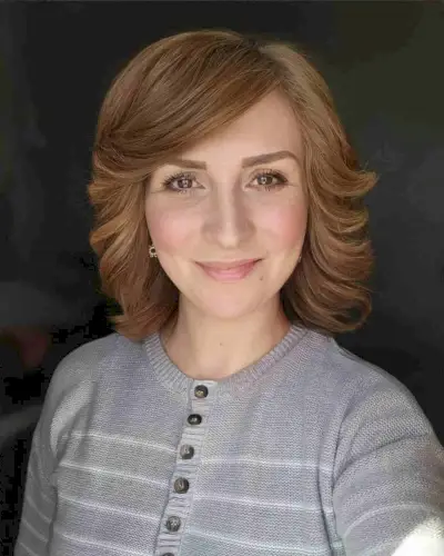 Mid-Length Feathered Shag Cut with Side-Swept Bangs