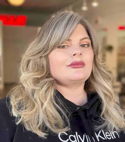 Medium Haircut with Long Layers and Long Side Bangs