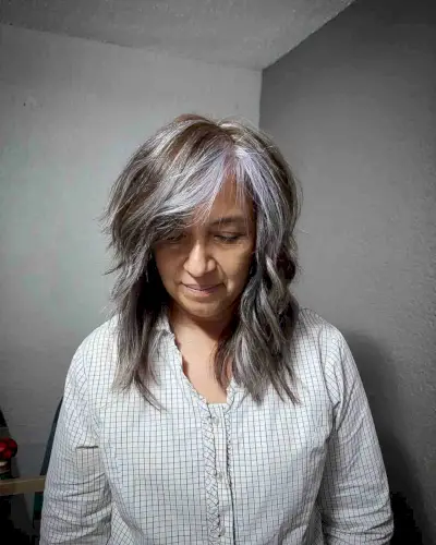 Mid-Length Shag with Layers and Side Bangs for Women Over 50