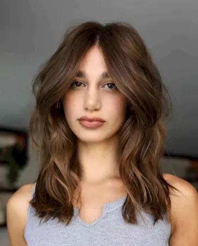 Face-Framing Layered Golden Brown Mid-Length Choppy Style