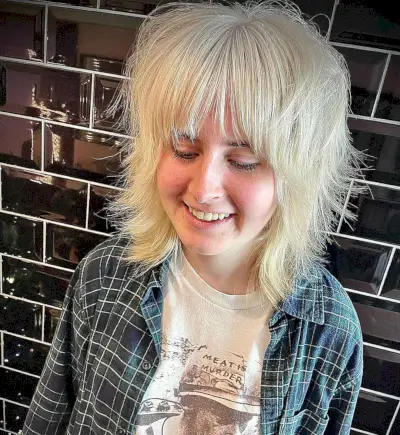 Choppy Shoulder-Length Cut with Wispy Bangs