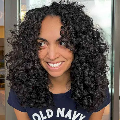 Rezo Curly Cut with a Face Frame on a Shoulder-Length Cut for Thick-Haired Ladies