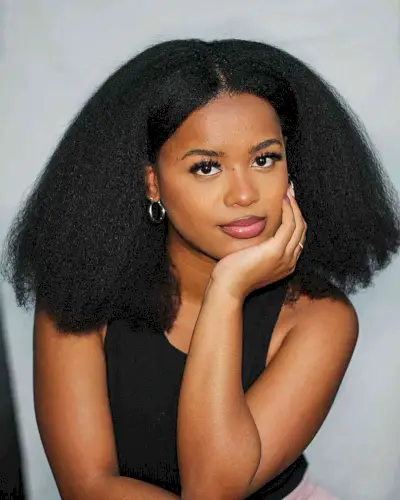 Center-Parted Thick Style with Layers on a Shoulder-Length Cut and Kinky Black Hair