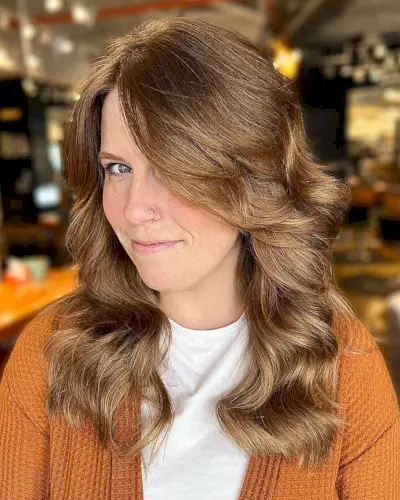 Soft Wavy Medium Layers with Long Bangs for Thick-Haired Ladies with Long Faces