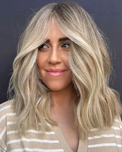 Gorgeous Blonde Foiled Thick Medium-Length Hair for ladies with blunt ends and middle part