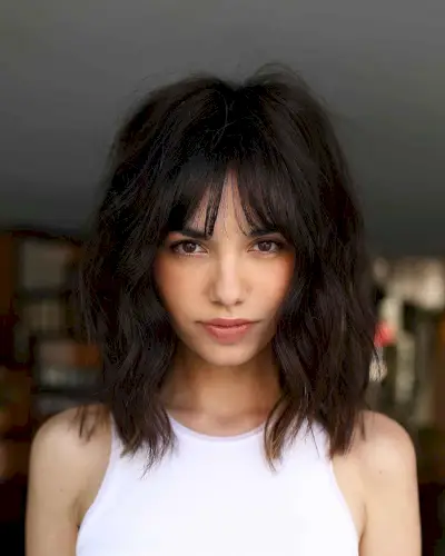 textured shoulder-length wavy layered haircut