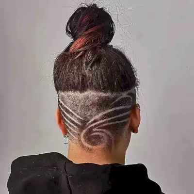 Tattooed undercut on shoulder length hair