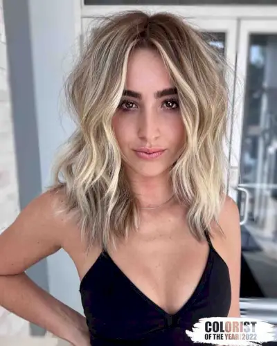 Tousled middle part layers for medium length hair