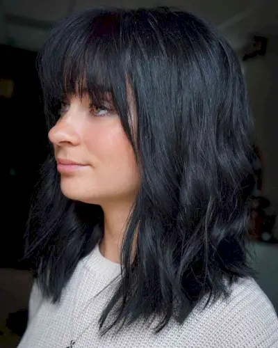 Messy bangs and layers shoulder-length