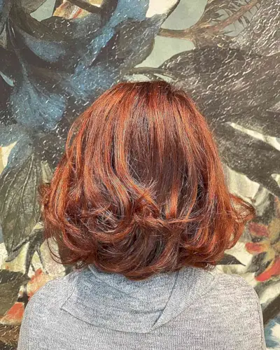Attractive auburn color shoulder length hair