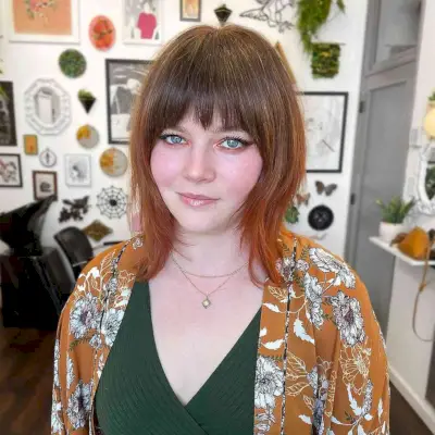 Shoulder-Length Layered Wolf Cut with Bangs