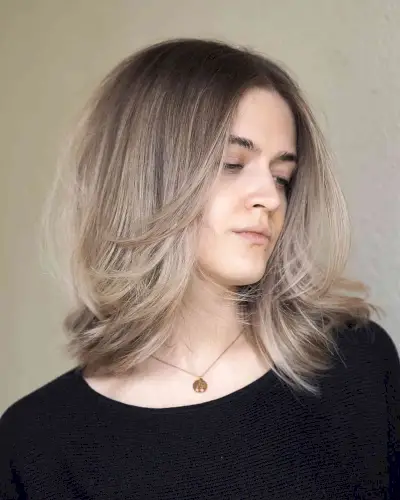 Mid-Length Middle Part Hairstyle with Front Layers