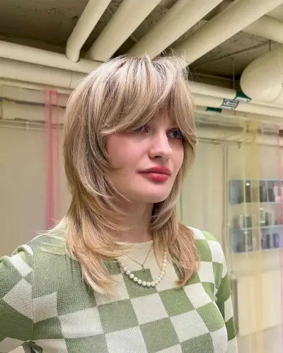 Face-Framing Bangs on a Mid-Length Layered Cut