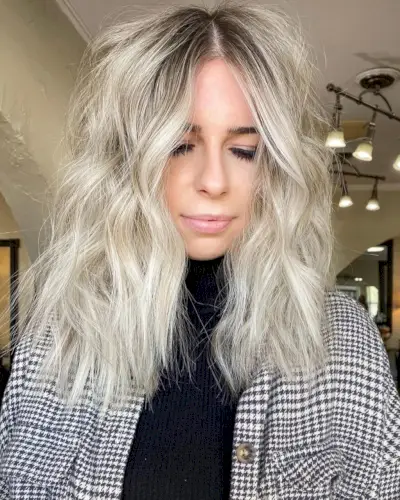 A Cool Center Part Shag with Choppy Layers and Platinum Hue