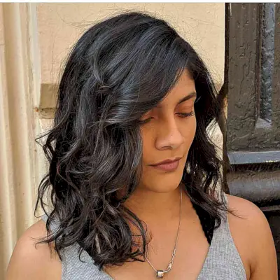 Shoulder-Length Jet Black Waves in Hair