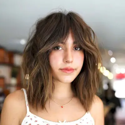 Mid-Length Curtain Bangs for Oval Faces