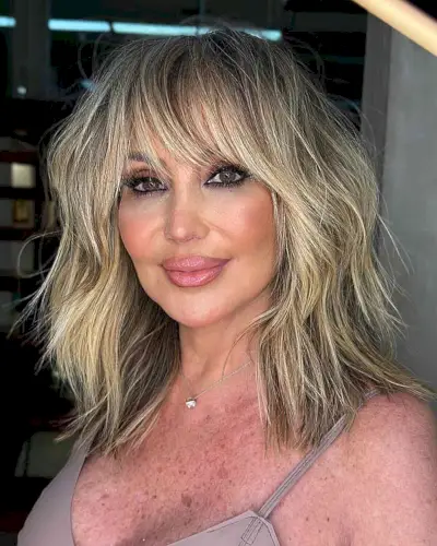 Medium-Length Face-Framing Visible Layers for women with wispy hair and bangs