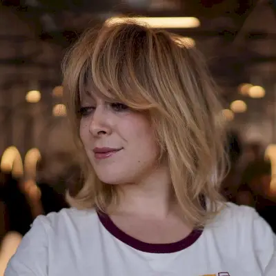 Shoulder-Length Shagged Bob with Heavy Bangs