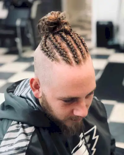 Man bun fade with cornrows