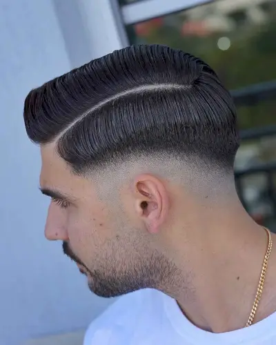 low bald fade with a hard part