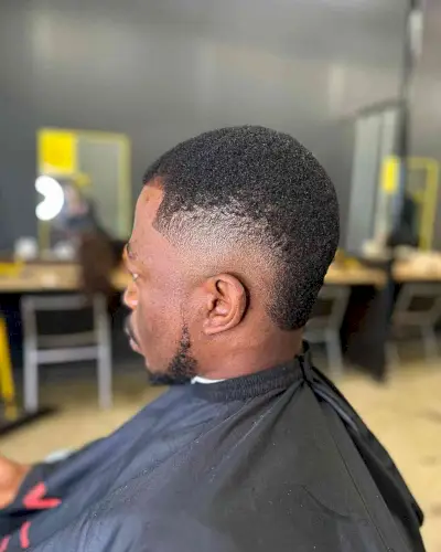 Buzzed Burst Skin Fade for Short Curls on Black Men
