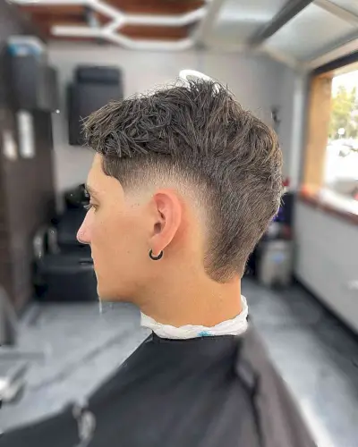 Tapered Low Burst Fade with Messy Top for Guys