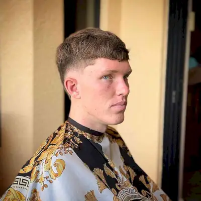 Low Buzz Burst Fade and Short Bangs for Young Guys